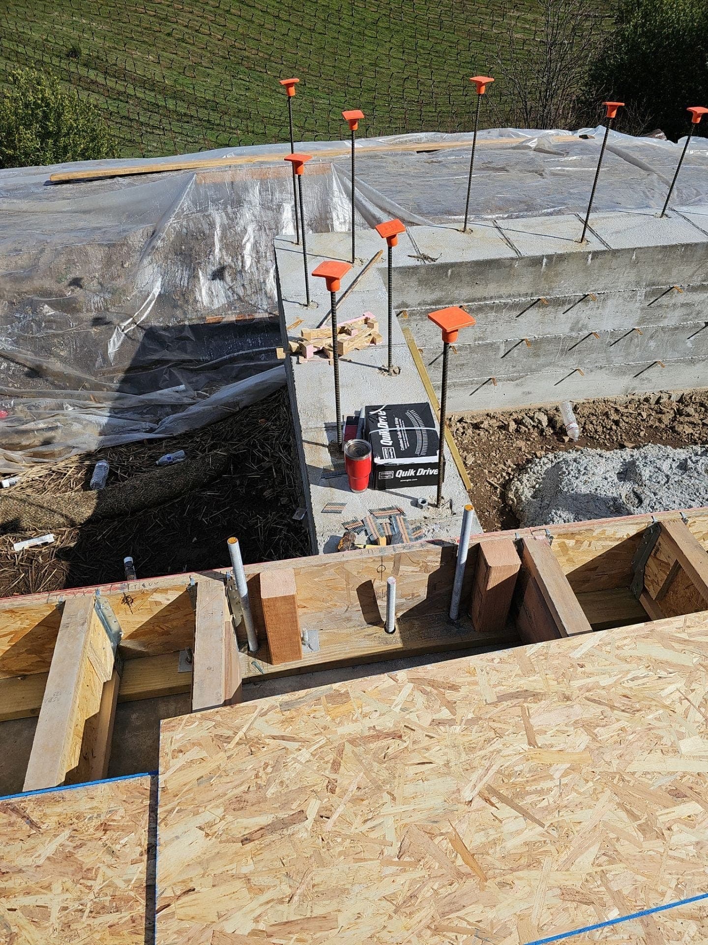 Concrete stem-wall foundation with anchor bolts, treated mudsill, and OSB subfloor at the start of a new home build by RLS Custom Carpentry in Mendocino County, CA