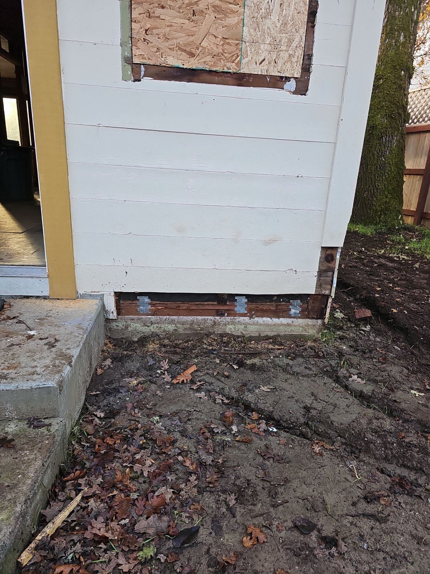House corner with new sill plate, anchor bolts and seismic brackets after a foundation retrofit by RLS Custom Carpentry in Mendocino County, CA