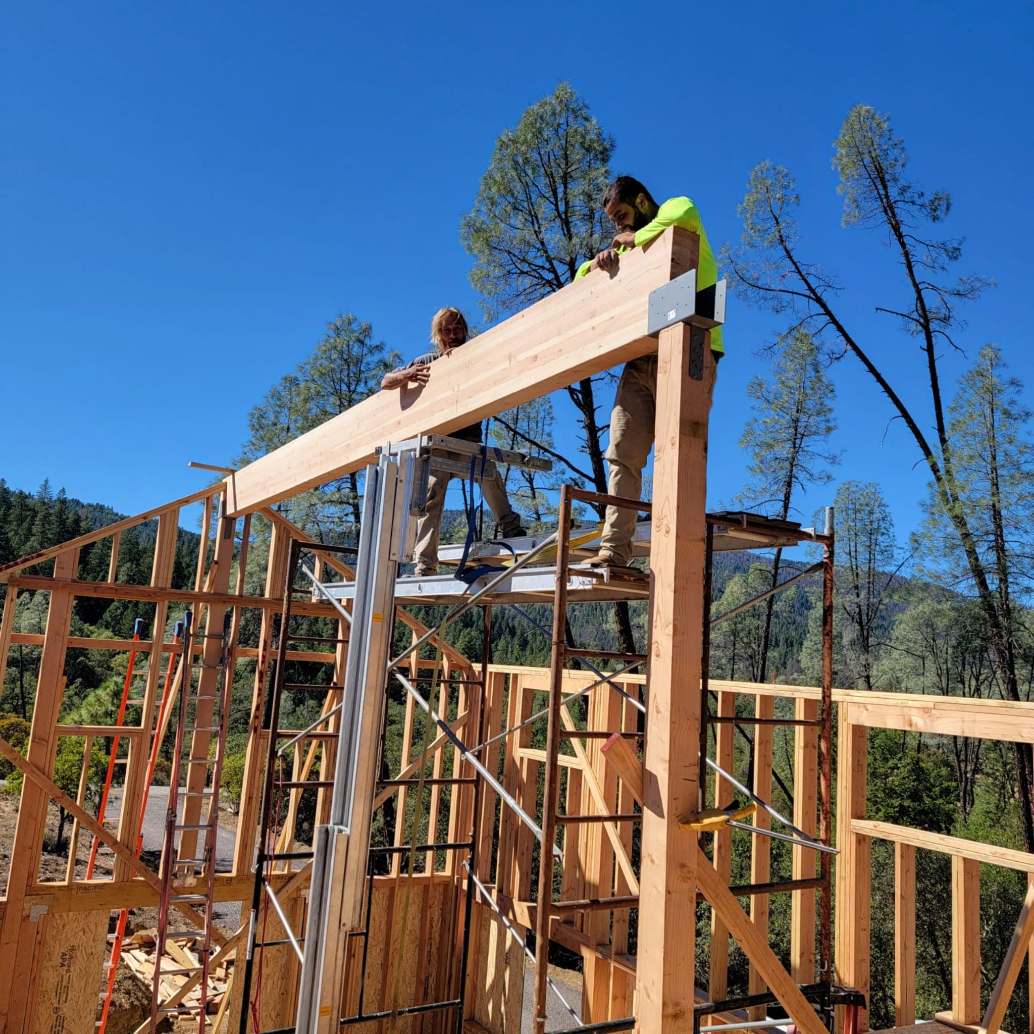 New-home framing skeleton against the mountains, framed by RLS Custom Carpentry in Mendocino County, CA