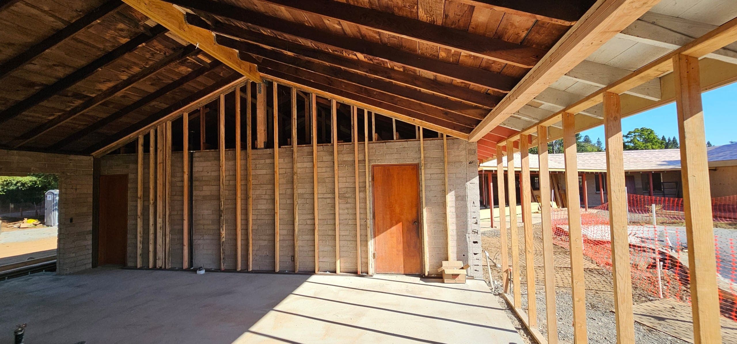 Panoramic interior view of new-home framing by RLS Custom Carpentry in Mendocino County, CA